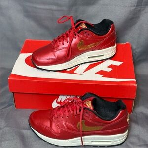 Nike Air Max 1 in University Red and Metallic Gold